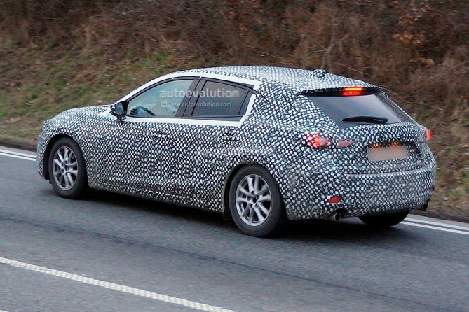 spyshots-2014-mazda3-spotted-for-the-fist-time_4.jpg